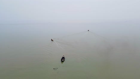 Wooden-Fishing-Boats-In-The-Calm-Ocean-In-Bangladesh-During-Monsoon-Season---Aerial-Drone-Shot