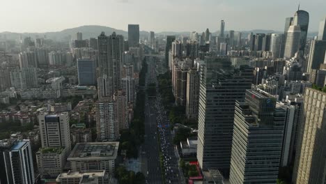 Vista-Aérea-Del-Distrito-De-Tianhe-Sobre-La-Carretera-Huaxia,-Distrito-Financiero-De-Guangzhou-Al-Atardecer