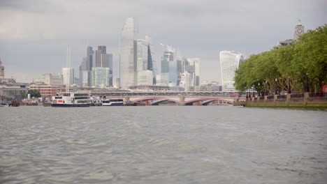 View-from-River-Thames-of-London-skyscrapers-on-city-skyline,-United-Kingdom
