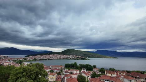 Cloudy-grey-skyline-over-Lake-Orestiada-in-Kastoria,-Greece,-wide-city-view