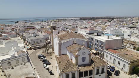 Aerial-view-of-Olhão,-Portugal,-featuring-the-Igreja-de-Nossa-Senhora-do-Rosário-and-surrounding-buildings