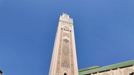Tower-minaret-of-Hassan-II-Mosque,-ornate-islamic-worship,-Casablanca-Morocco