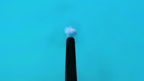 Environment-pollution-by-industrial-chimney-smoke.-Blue-background