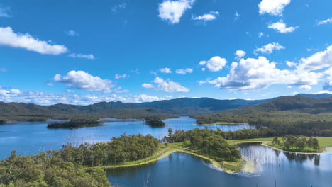 Gorgeous-summers-day-aerial-above-the-lush-forests-and-water-plants-of-Teemburra-Dam