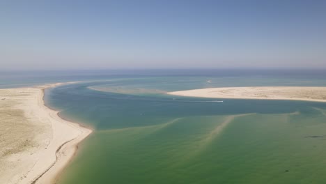 Aerial-of-Armona-Island-in-Olhão,-Portugal,-showcasing-pristine-beaches-and-turquoise-waters