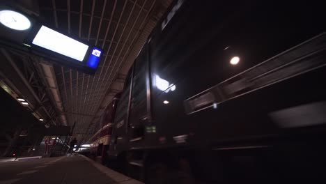 Train-arriving-in-Amsterdam-Central-Station---Centraal-Station---sustainable-travel,-low-ultrawide-angle-platform-view