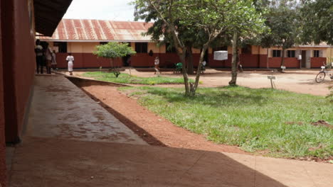 Child-Students-Entering-A-School-Classroom-In-Uganda,-Africa