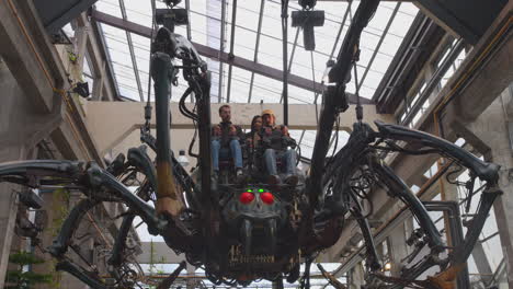 Low-angle-shot-of-a-hanging-mechanical-Spider-which-is-part-of-the-Machines-in-the-Isle-of-Nantes,-France