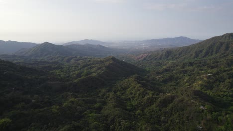 Aerial-view-of-lush-green-mountains-and-valleys-in-Minca,-Colombia