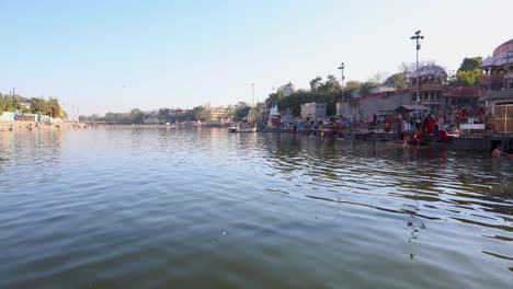 pristine-holy-Shipra-river-shore-with-ancient-temple-and-bright-blue-sky-at-morning-video-is-taken-at-shipra-river-ujjain-madhya-pradesh-india-on-Mar-09-2024