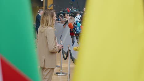 President-of-the-European-Parliament-Roberta-Metsola-talking-to-the-press-at-the-EU-Council-summit-in-Brussels,-Belgium---Profile-shot