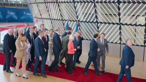 NATO-Secretary-General-Mark-Rutte-and-Ukrainian-President-Volodymyr-Zelensky-walking-away-after-group-photo-with-EU-leaders-at-the-European-Council---Brussels,-Belgium