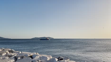 Ships-passing-by-the-sea-at-sunset-on-the-beach