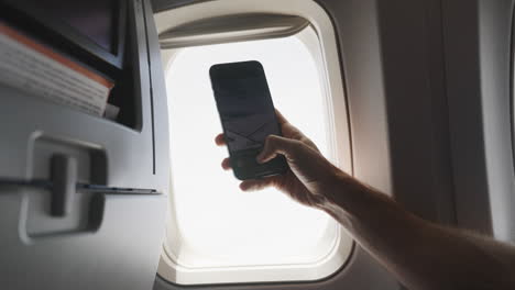 Taking-selfie-from-airplane-window