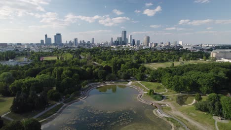 Green-park-and-Warsaw-skyline-in-horizon,-aerial-view