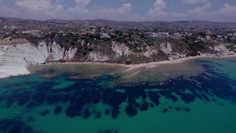 Aerial-reveal-white-cliffs-in-Mediterranean-Sea-Scala-dei-Turchi,-Sicily