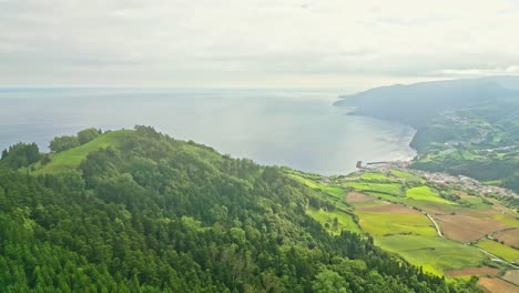 Miraduro-dos-picos-dos-bodes-in-azores-portugal-with-lush-green-hills-and-ocean-views,-aerial-view