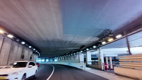 The-famous-Monaco-tunnel,-the-longest-curved-straightaway-in-the-Circuit-de-Monaco-at-the-historic-Grand-Prix,-with-crash-barriers-installed-throughout-in-preparation-for-Formula-1-racing