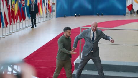 Ukrainian-President-Volodymyr-Zelensky-and-former-European-president-Charles-Michel-arriving-on-the-red-carpet-at-the-European-Council-summit-in-Brussels,-Belgium---Slow-motion