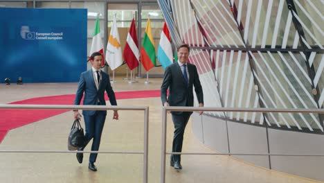 NATO-Secretary-General-Mark-Rutte-waving-to-the-press-at-the-European-summit-arrival-in-Brussels,-Belgium---Slow-motion