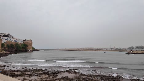 Atlantic-coast,-rocky-beach-small-ocean-waves-in-Rabat,-Morocco