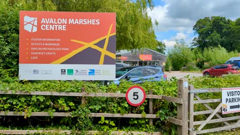 Welcome-sign-for-Avalon-Marshes-Visitor-Centre-for-walks-and-bird-watching-at-nature-reserve-on-the-Somerset-Levels-in-England-UK