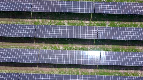 Solar-panel-field-close-up-aerial-view-in-sunny-daylight