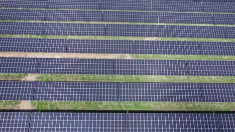 Solar-panel-field-close-up-aerial-view-in-sunny-daylight