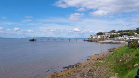 Scenic-view-of-Clevedon-seaside-town-and-pier-overlooking-coastline,-beach-and-Severn-estuary-in-Somerset,-England-UK