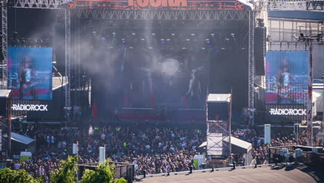 Time-lapse-of-a-band-performing-at-the-Tuska-Festival-in-sunny-Helsinki,-Finland