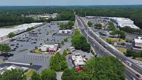 East-Cobb-Crossing-Shopping-Center-in-Marietta-Town-with-traffic-on-highway-during-sunny-summer-day