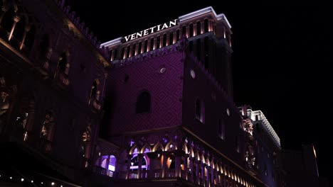 Venetian-Hotel-and-Casino-Exterior-at-NIght,-Illumination-and-Logo,-Las-Vegas-USA