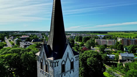 Keila-Church-tower-in-Estonia,-drone-circling