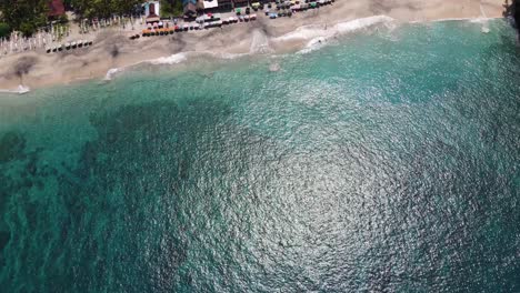 Aerial-drone-footage-of-Virgin-Beach's-white-sand-and-clear-sea-in-Karangasem,-Bali,-Indonesia