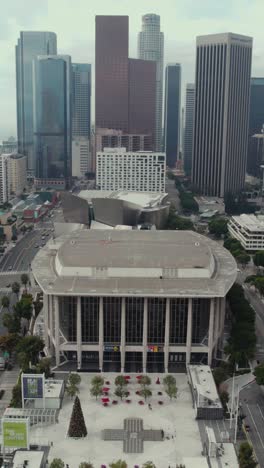 Vertical-Drone-Shot-of-Los-Angeles-USA-Downtown-Buildings,-Opera-House,-Walt-Disney-Concert-Hall-and-Street-Traffic