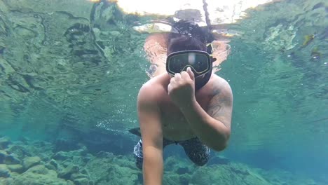 Snorkeling-man,-swimming-in-ocean