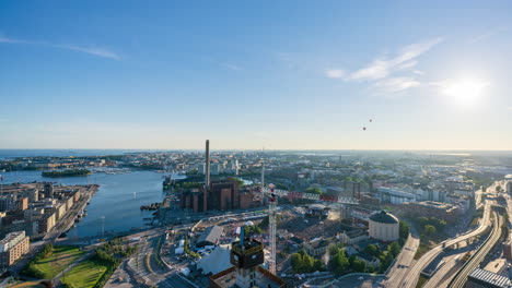 Time-lapse-of-Hot-Air-Balloons-flying-over-the-Helsinki-skyline,-sunny-day