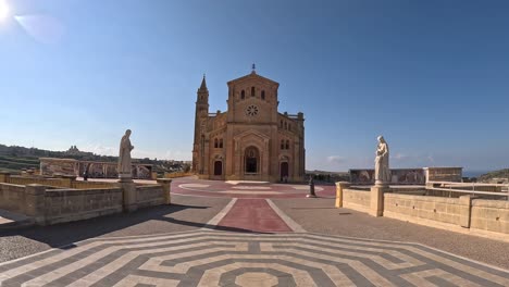 Closing-up-to-the-Basilica-of-the-Blessed-Virgin-of-Ta'-Pinu-on-Gozo-Island,-Malta,-highlighting-its-architectural-beauty-and-spiritual-significance