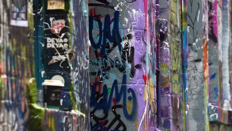 Close-up-shot-to-the-artistic-graffiti-walls,-street-art-laneway,-expression-of-colours-and-concept-of-vandalism