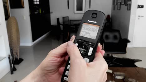 Push-button-handheld-house-telephone,-retro-style-technology,-slow-mo