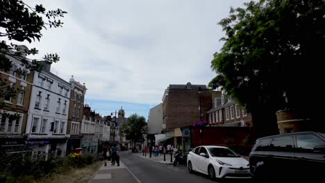 Richmond,-London:-Strolling-through-the-streets-of-High-Street,-enjoying-the-vibrant-atmosphere,-diverse-shops,-and-inviting-restaurants