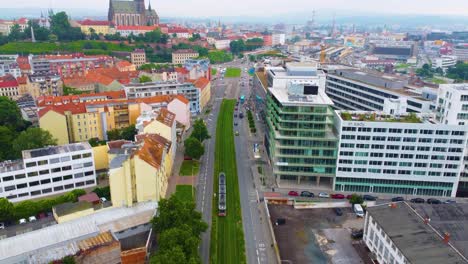 Aerial-view-of-Brno-with-road-in-heart-of-cityscape,-blending-historic-structures-with-modern-buildings