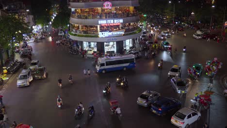Busy-evening-traffic-surrounds-Hanoi's-Dong-Kinh-Nghia-Thuc-Square-with-vibrant-lights-and-bustling-activity