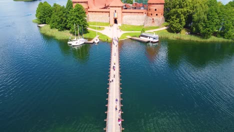 Trakai-Island-Castle's-bridge-links-fortress-to-mainland,-enhancing-its-historical-allure