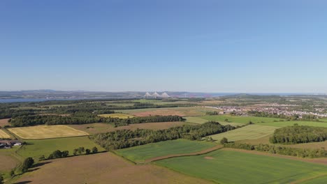 Forth-road-bridges-from-a-distance-with-farms-in-the-foreground