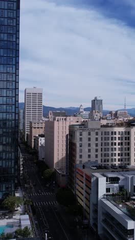 Los-Angeles-USA,-Vertical-Aerial-View-of-DTLA,-South-Park-and-Commercial-Exchange-Building,-Drone-Shot