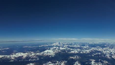 POV-pilot-POV-of-The-Alps-range,-shot-from-an-airplane-cabin