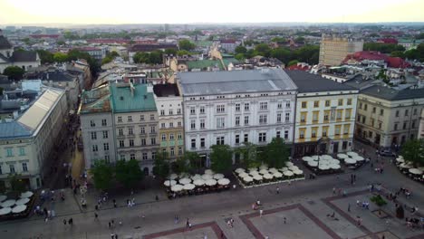 Krakow's-Old-Town-Square,-pedestrian-areas,-and-outdoor-cafes,-vibrant-atmosphere-of-this-cultural-hub,-Krakow,-Poland