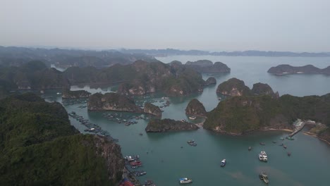 drone-shot-of-groups-of-islands-in-bright-blue-water-in-Cat-Ba-and-Halong-Bay-in-Northern-Vietnam