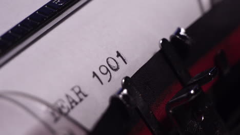 Year-1901,-Typing-on-Blank-White-Paper-in-Vintage-Typewriter,-Close-Up